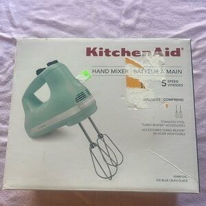 Mint green kitchen aid 5 speed hand mixer .